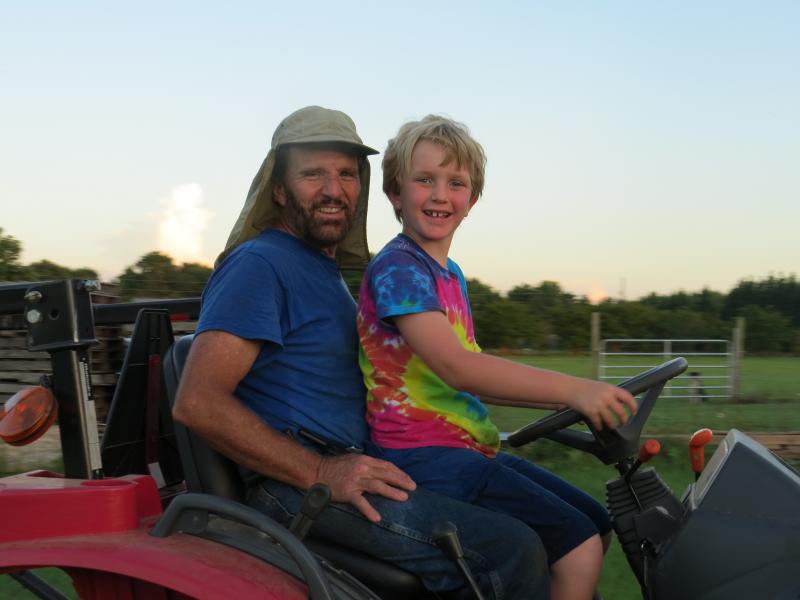 GranDon & grandson Robert riding the tractor!